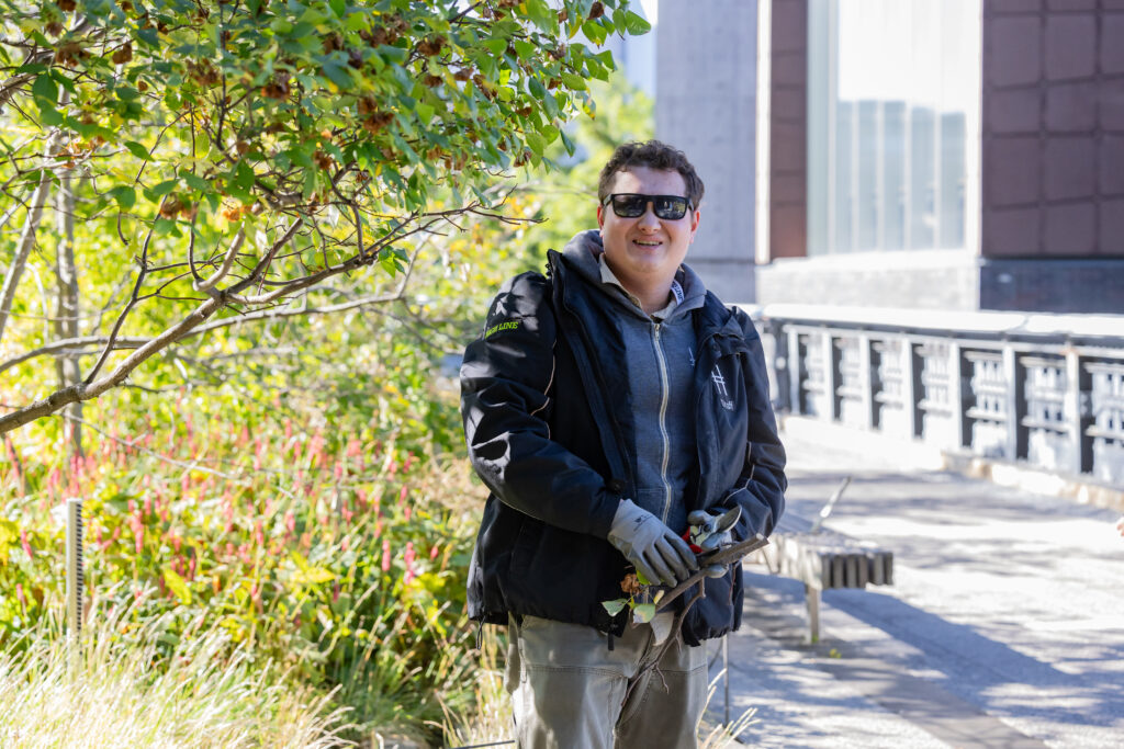 A gardener stands in the High Line's gardens